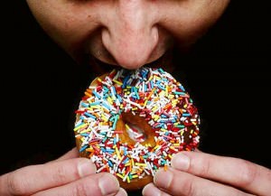 man eating donut