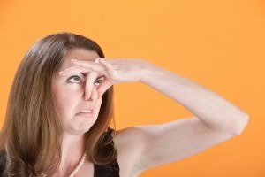 woman holding nose 2