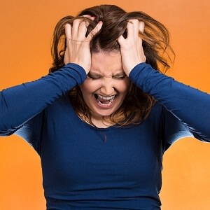 woman holding head 2