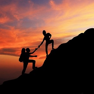 man woman mountain climbing
