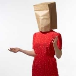 woman wearing paper bag