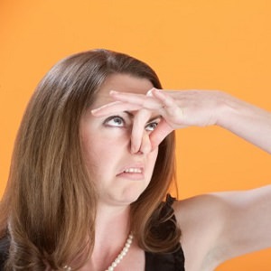 woman holding nose 4