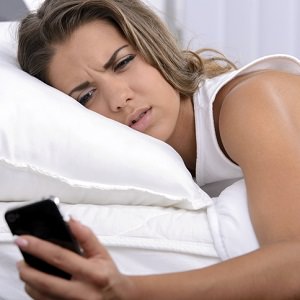 woman looking at phone